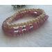 This 3 stack bracelet is pink and cream.  It is stretchy and very pretty.